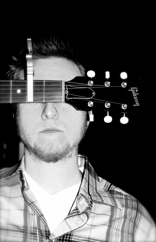 Randall Breneman with his Gibson Guitar by Sandi Thom